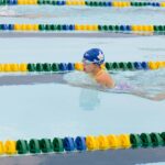 A group of people swimming in a pool