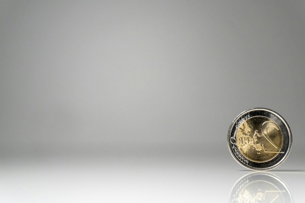 a close up of a coin on a white surface